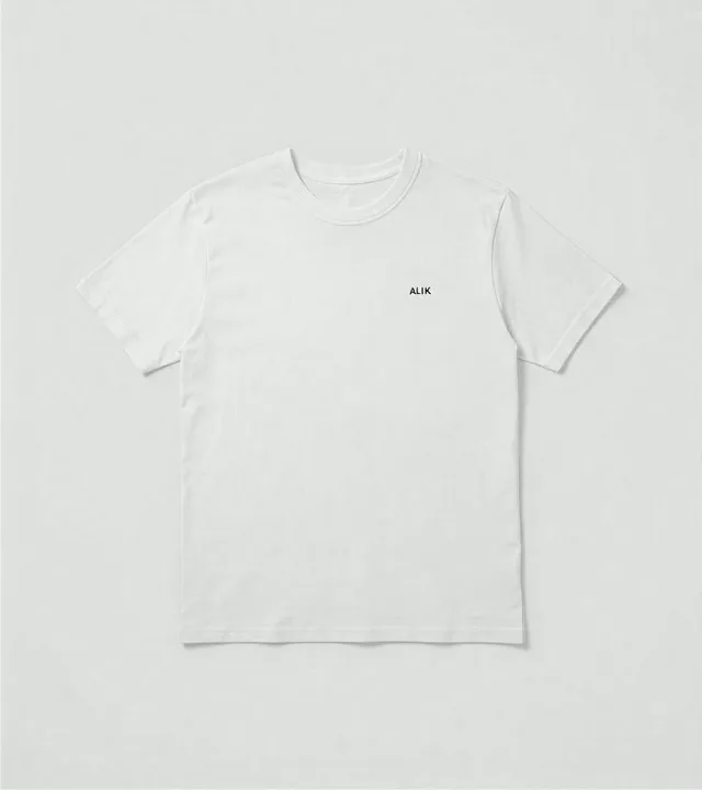 Bone white standard tee laid flat against a light gray studio background